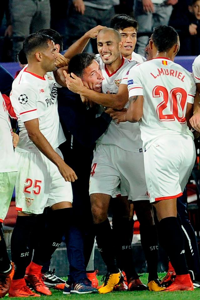 Sevilla players rushed to celebrate their late equaliser with their manager