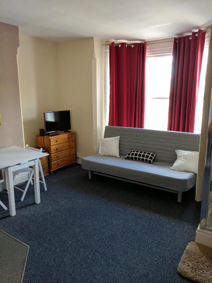  A near identical flat in the same block features a sofa bed next to the shower