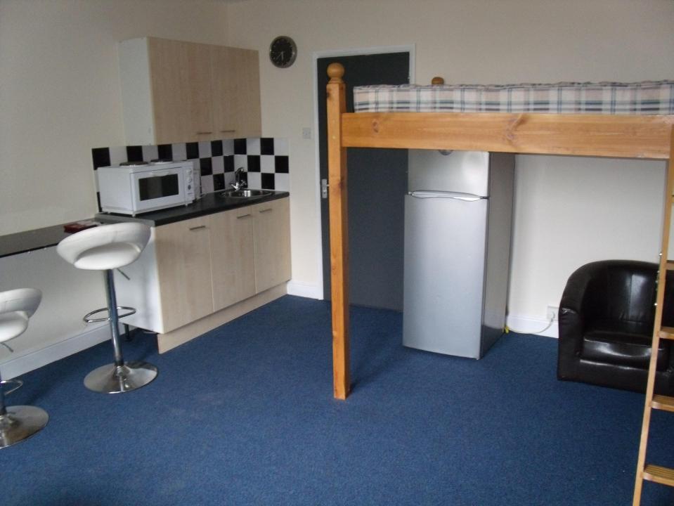  Tiny bedsit in Nottingham sees a fridge squeezed under a bunk bed