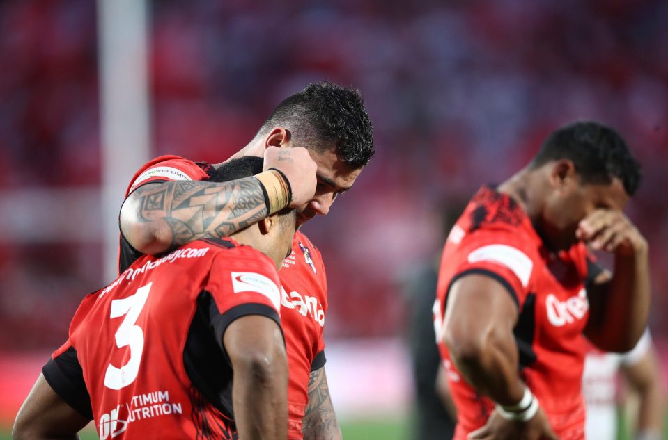 Michael Jennings and Andrew Fifita of Tonga console each other following defeat