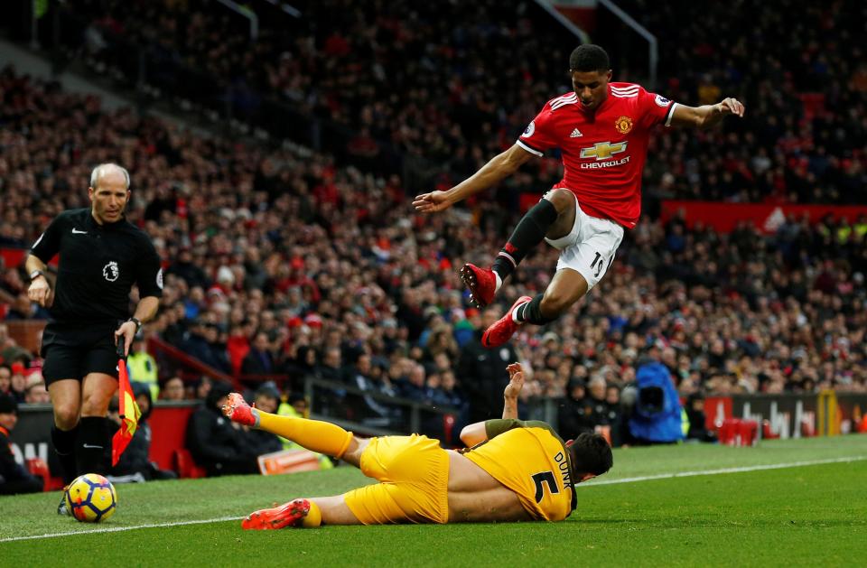 Lewis Dunk slides in strongly to rob Marcus Rashford