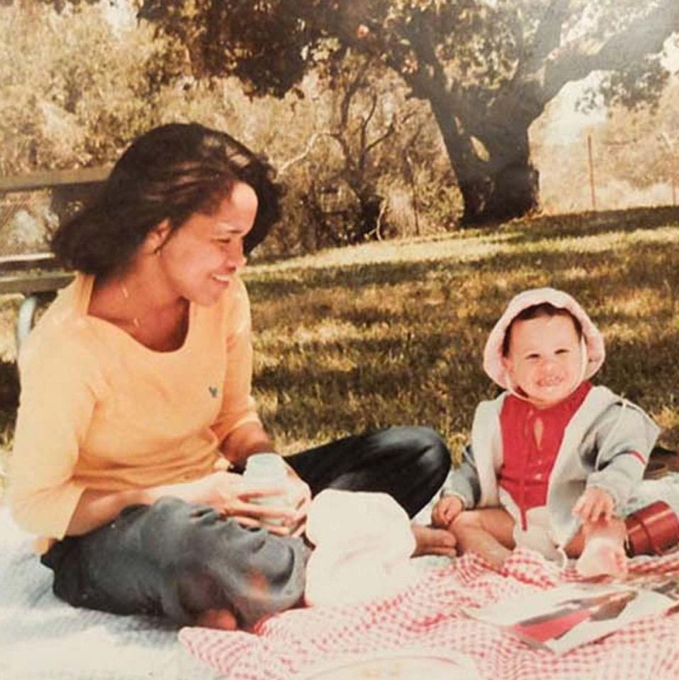  Meghan in Rwanda with her mum as a child