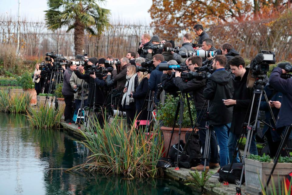  The world's press gather outside of Kensington Palace where Prince Harry and Meghan Markle will arrive for a photo shoot later today