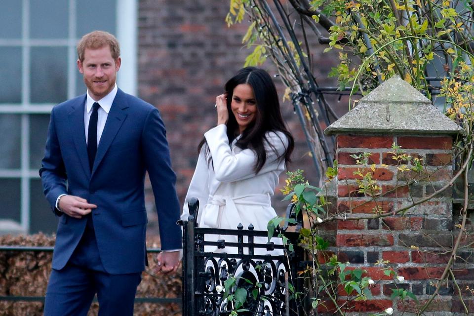  The smitten pair strolled through the palace's Sunken Garden to address the press