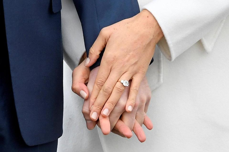 Harry designed his bride's engagement ring, which features two diamonds form his mum's personal collection