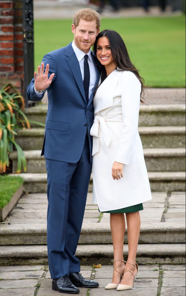  Meghan stunned in a Line The Label belted white coat during her engagement photo call