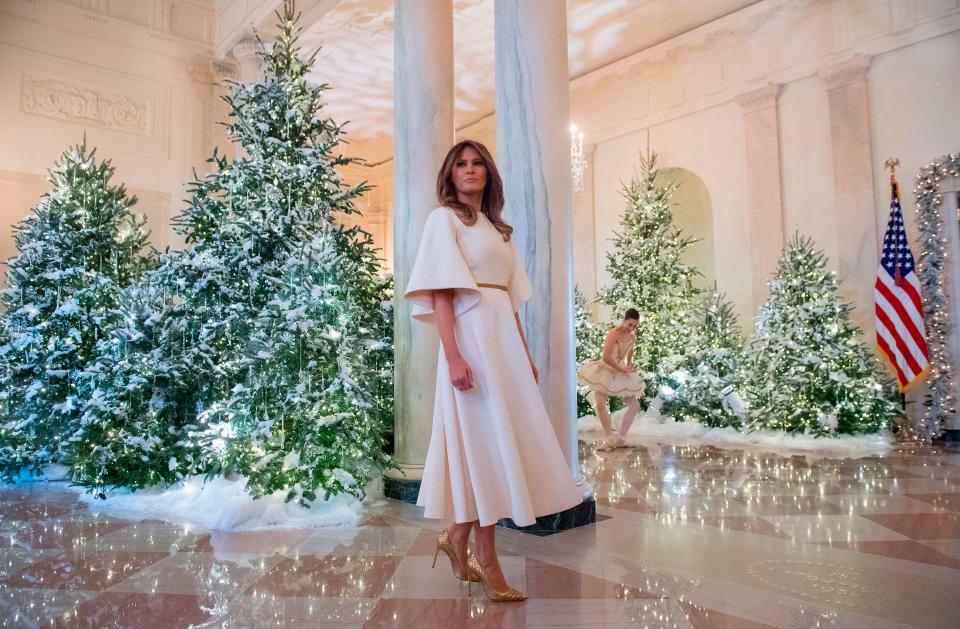  She inspected the towering trees in one of the White House's many lobbies