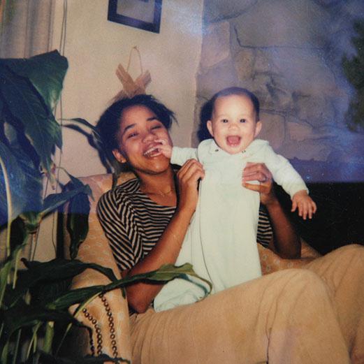  Prince Harry's fiancee Meghan as a grinning baby with her mum Doria Radlan