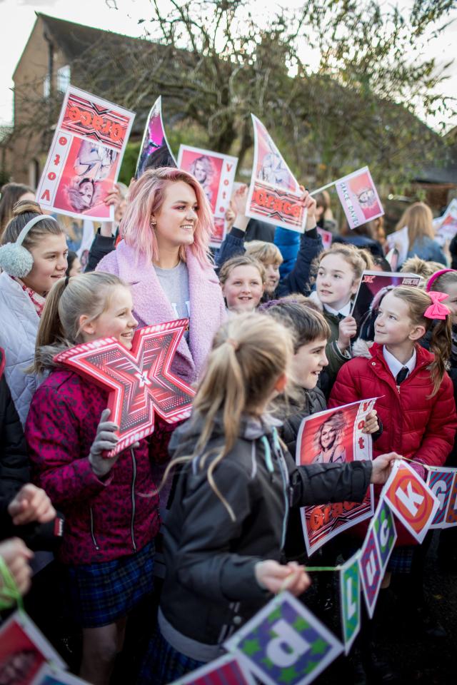  Grace beamed as she was greeted by her pals