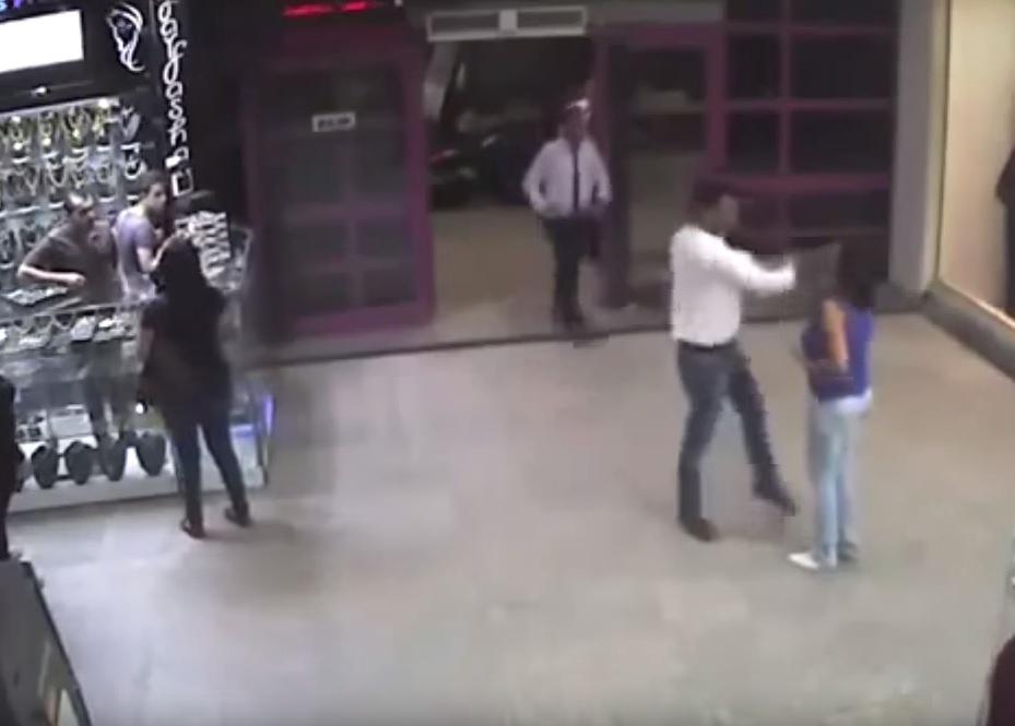 CCTV of the 2015 assault showing the man slapping Somaya at a shopping centre in Cairo