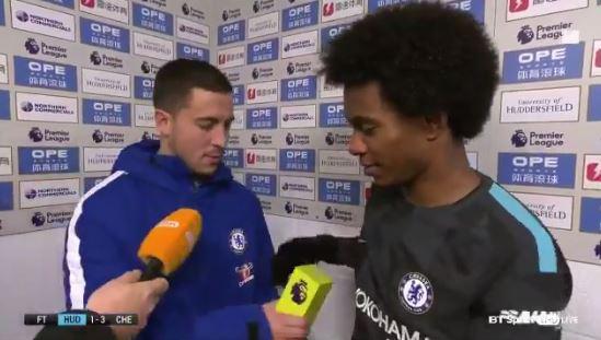 Eden Hazard hands Willian the Man of the Match award after Huddersfield win