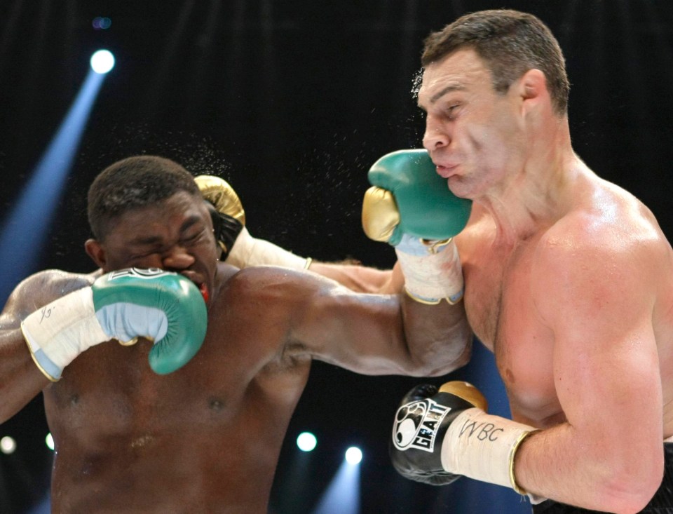 Samuel Peter appears to punch both Vitali Klitschko and himself at the same time