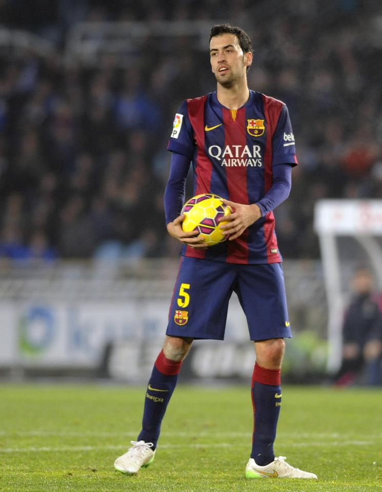  Sergio Busquets holds the ball during a match against Real Sociedad