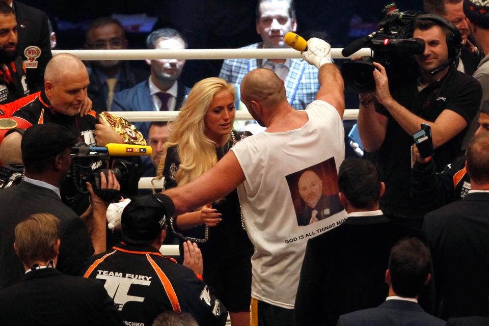 Tyson Fury hugs wife Paris after defeating Wladimir Klitschko in 2015