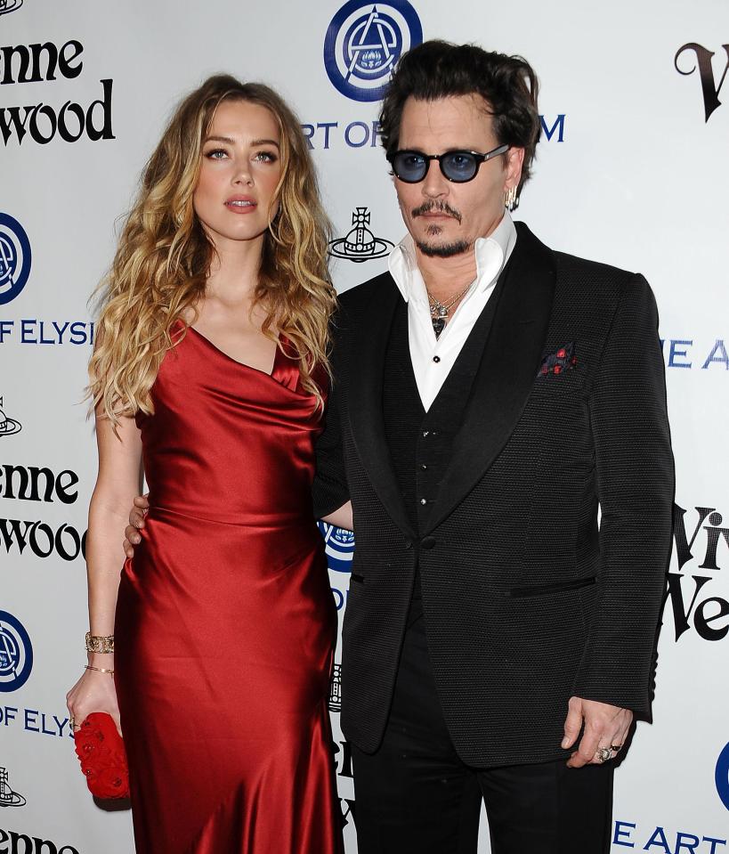  Johnny Depp, pictured with wife Amber Heard, in happier times