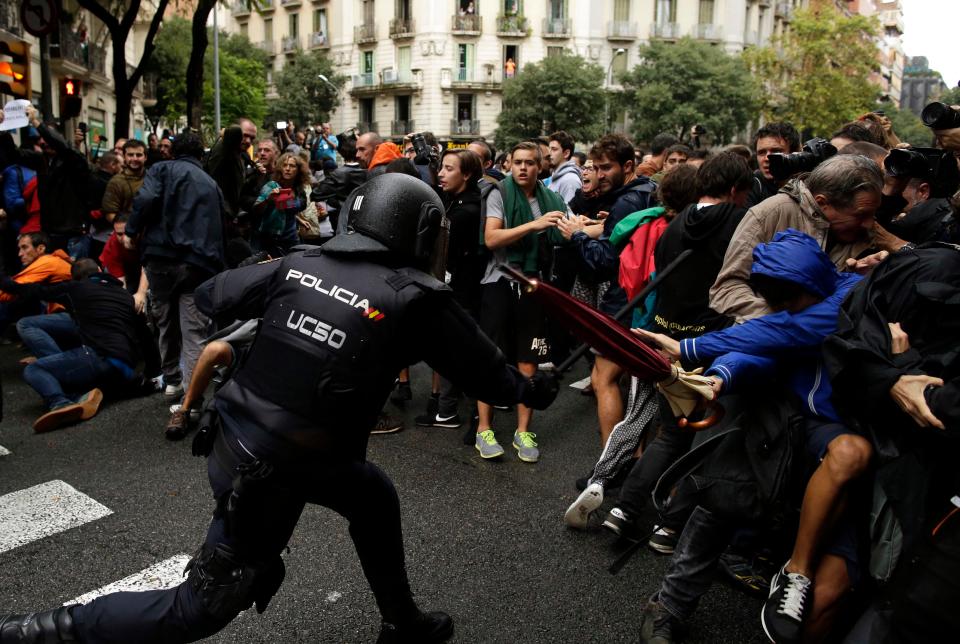 National police clash with pro-independence supporters on day of referendum