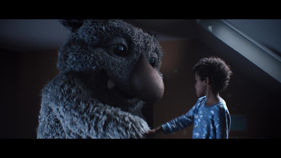  The ad features a young boy and his imaginary monster called Moz