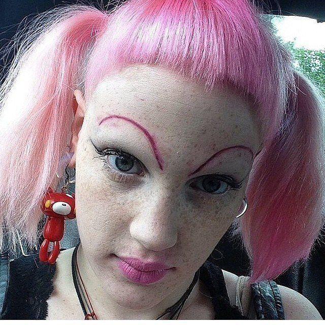  This girl seriously loves pink - and her short fringe perfectly shows off her extravagant brows