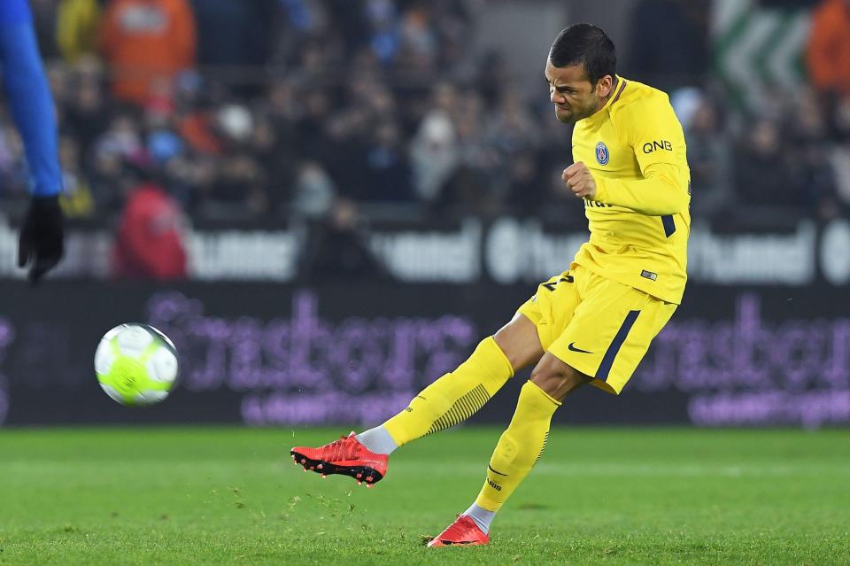  Defender Dani Alves clears possession at the Meinau Stadium