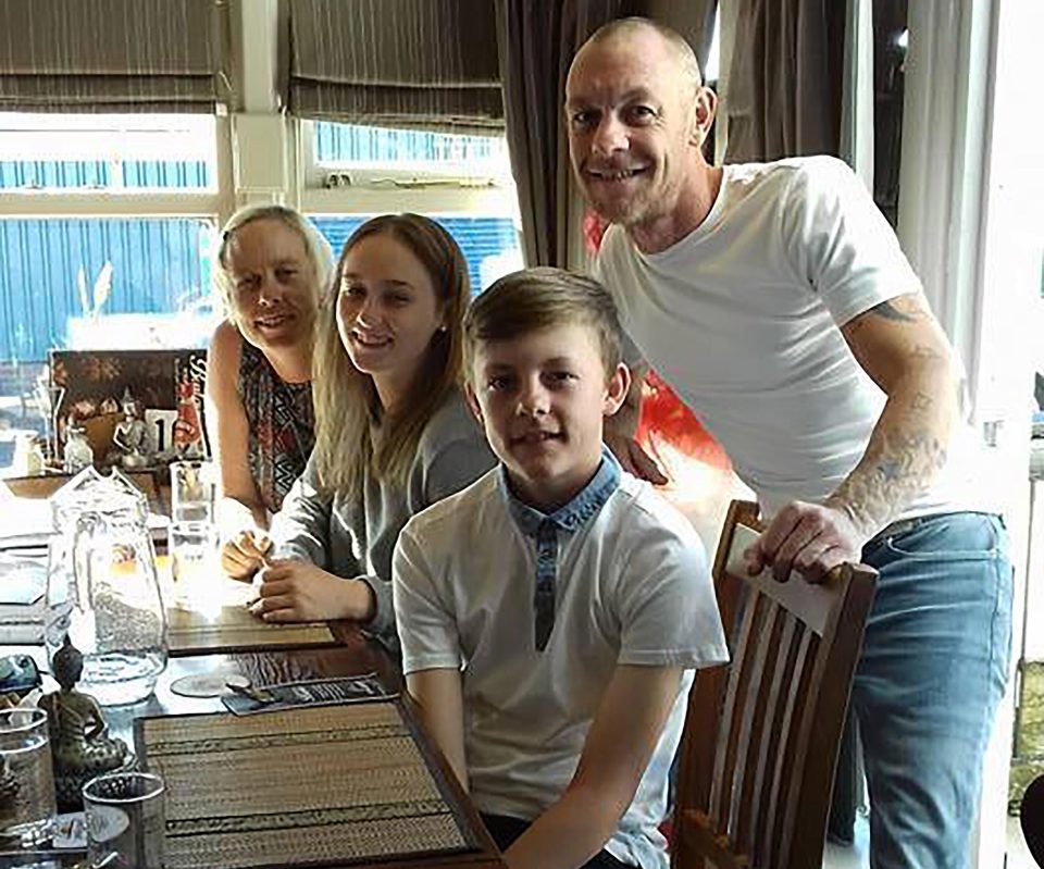  Sam is pictured with his mum Sarah, dad Gary and sister Charlie