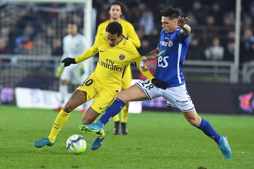  Brazilian ace Neymar vies for the ball with Jonas Martin