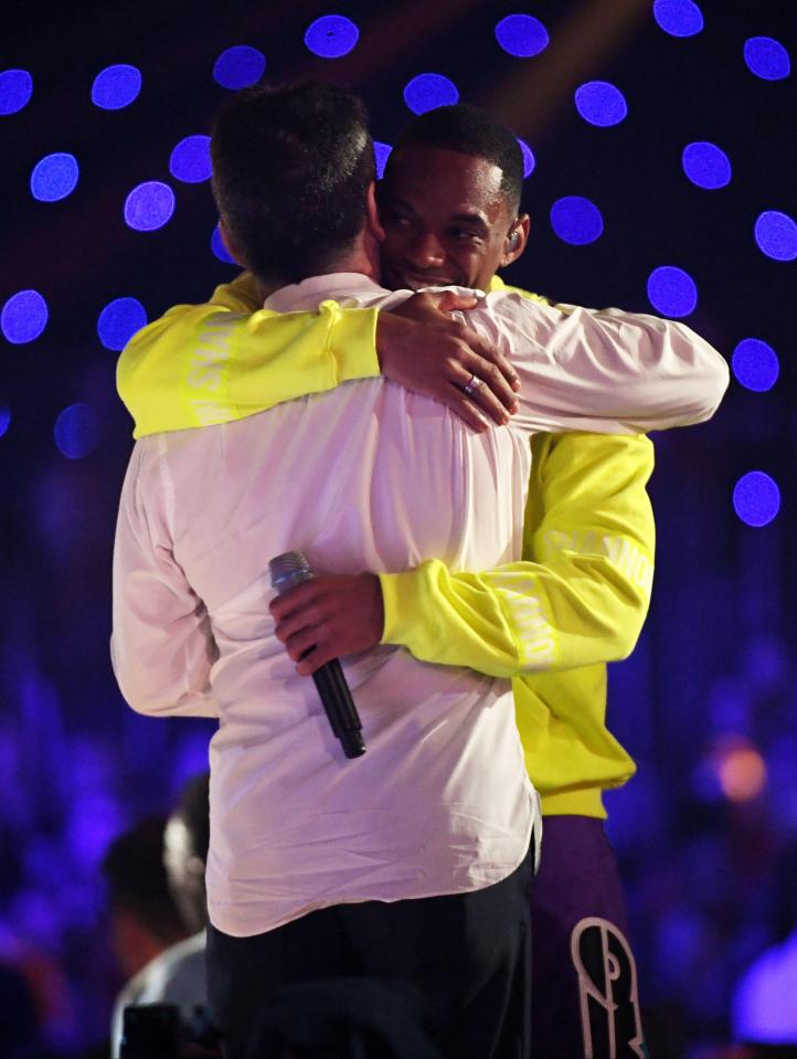  Simon was seen embracing Ashley after their performance