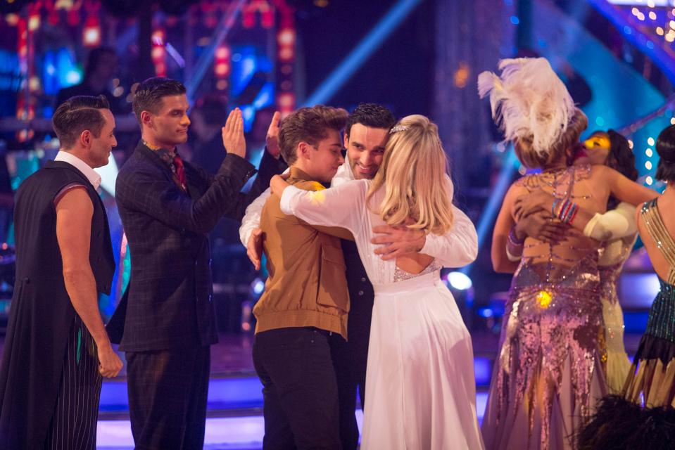  Davood gets a hug from AJ Pritchard and Mollie King