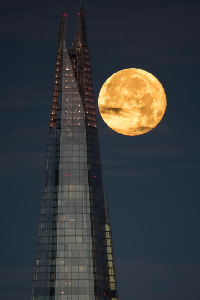  A supermoon is seen behind London's Shard skyscraper in December 2017