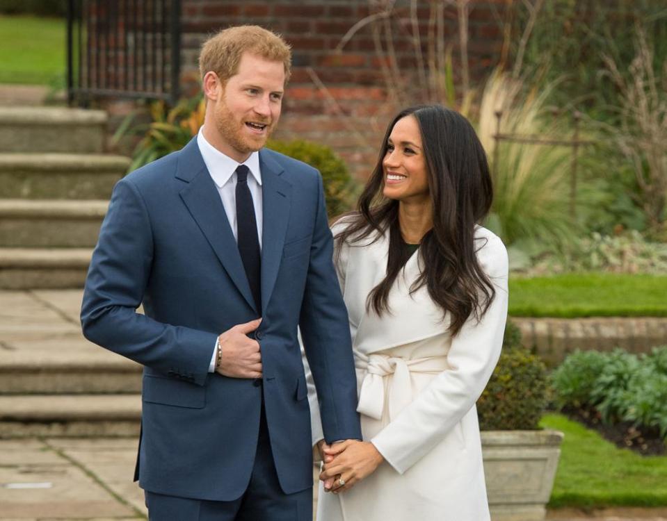  During their first public appearance as an engaged couple, Meghan proudly flashed her sparkly ring and smiled for the cameras