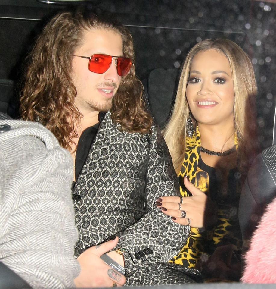 Rita changed into a bold yellow and black suit later in the evening and was seen with boyfriend Andrew Watts