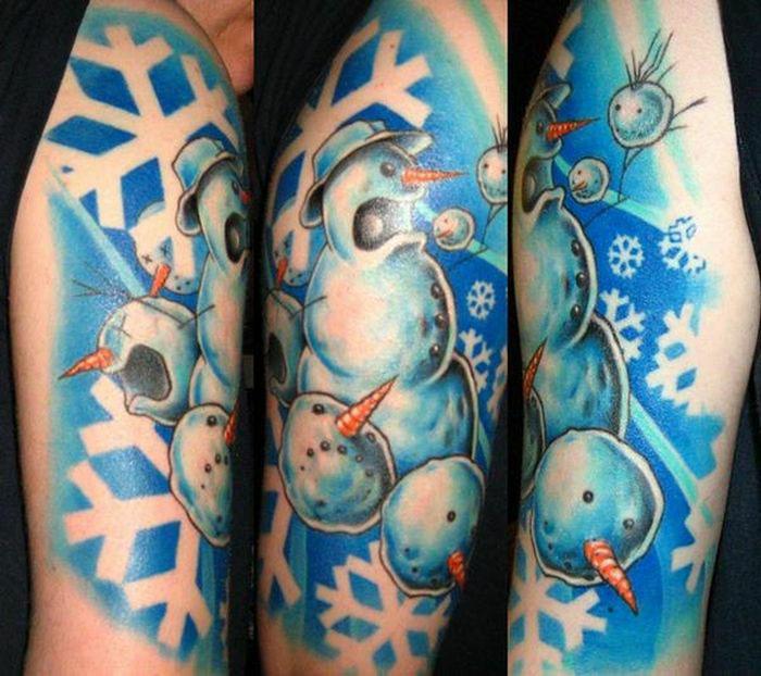  A tatt lover had a screaming snowman inked onto his arm, which is surrounded by snowflakes