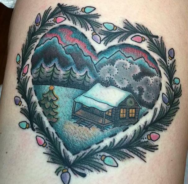  This pretty snow scene features a quaint country house encased in a heart