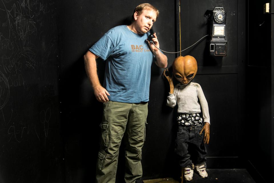  In one of the pictures, he kindly helps ET phone home