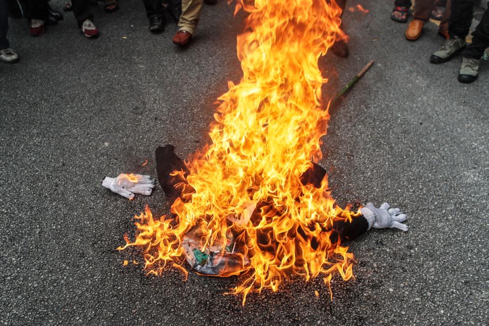  An effigy of US president Donald Trump is burned in Malaysia