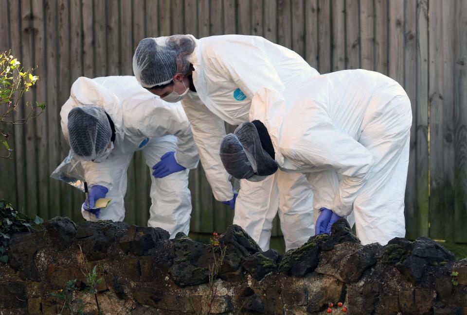  Forensics look for clues at the site of the attack