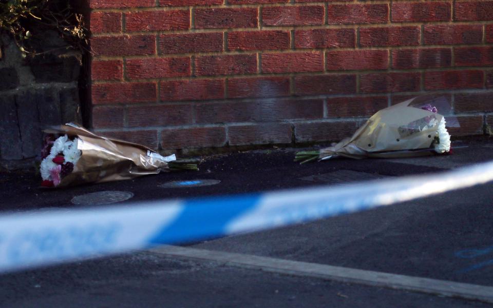  Flowers lie at the scene of the stabbing