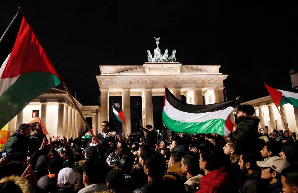  Protesters waved flags outside the Brandenburg Gate in Berlin