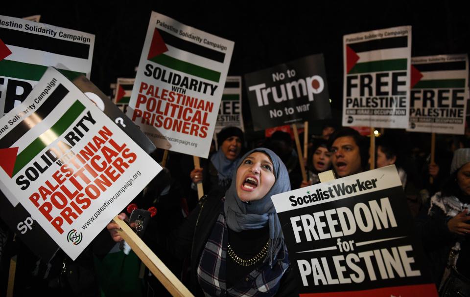  Demonstrators gathered outside the US Embassy in central London