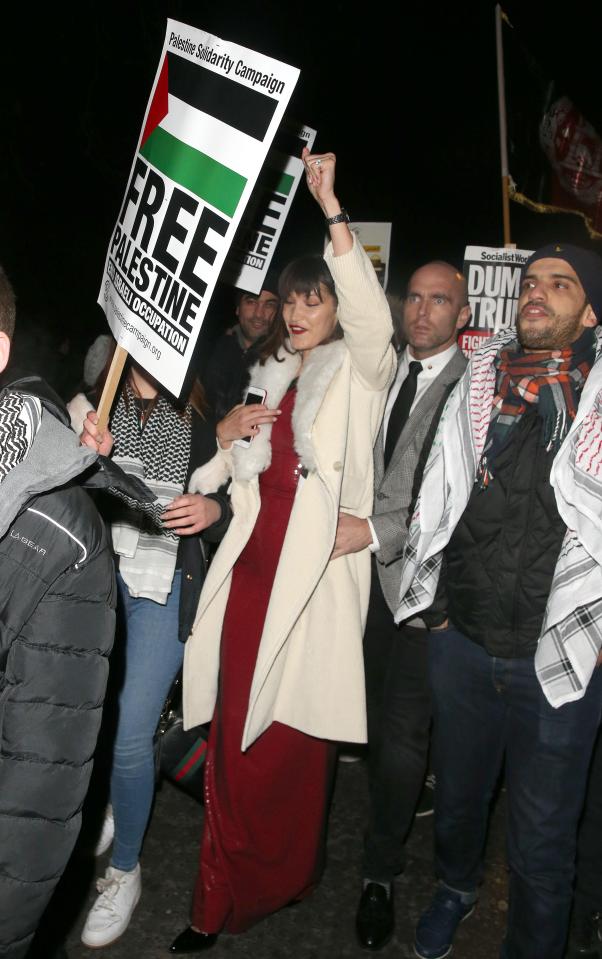  Bella seemed to enjoy the protest and waved her arm in the air