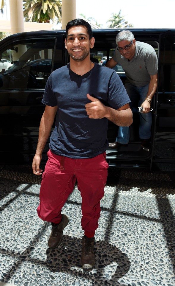 Amir beams as he arrives at the hotel where campmates stay once booted from the jungle