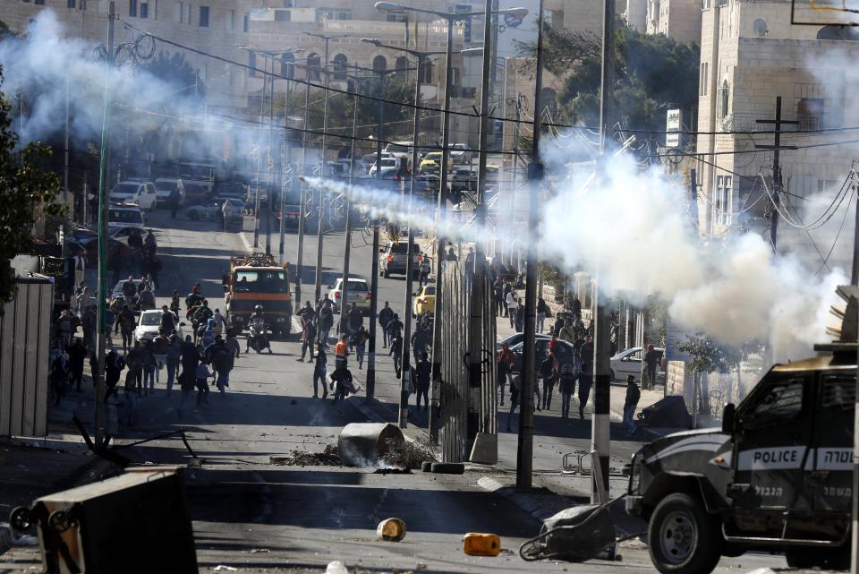  Palestinians and Israeli troops during clashes in the West Bank city of Bethlehem today