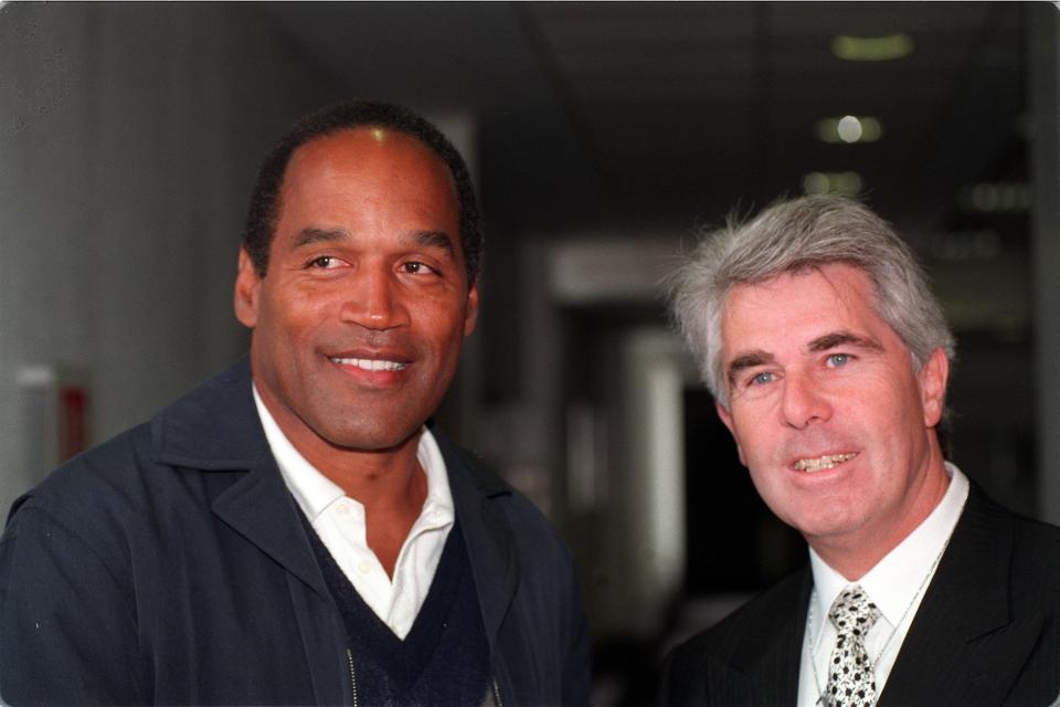  But the guru's empire came tumbling down after he was convicted. Here, Clifford with OJ Simpson