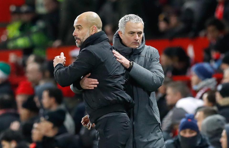  Jose Mourinho and Pep Guardiola embrace after the Manchester derby