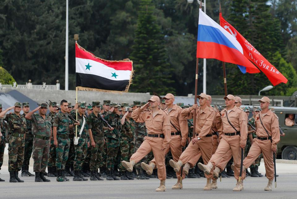 Russian soldiers at an airbase in Latakia province, Syria