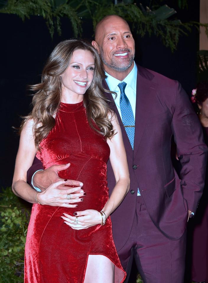  The Rock and girlfriend Lauren showed off her baby bump as they strode down the red carpet at the Jumanji rpemiere in Hollywood