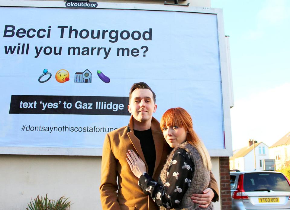  Gareth, 29, and Becci, 27, pose in front of the billboard