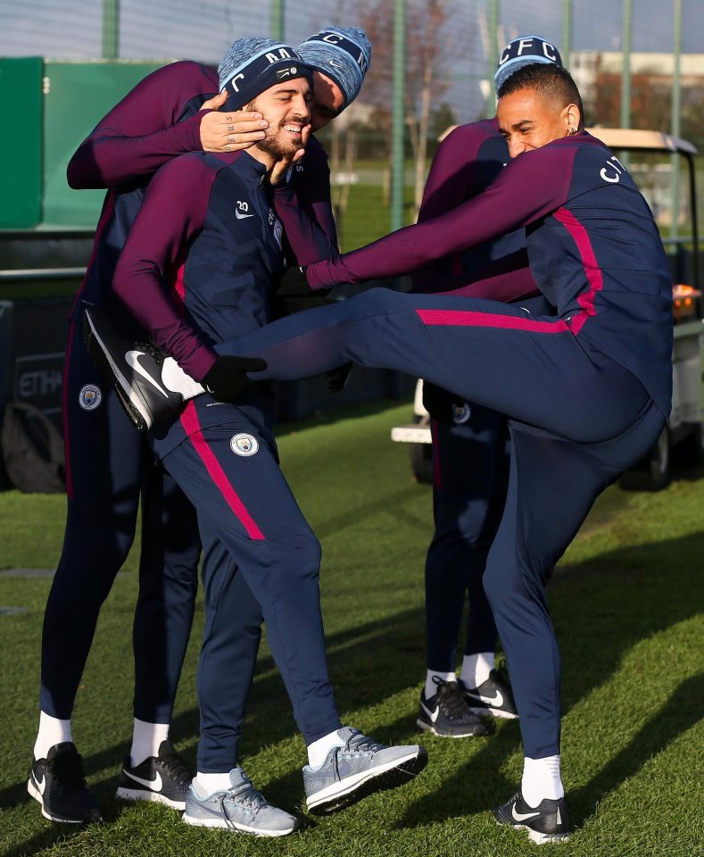  City set a Premier League record with a 15th win in a row against Swansea on Wednesday - Bernardo Silva shares a laugh with Danilo