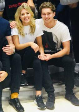  Mollie and AJ held hands in a group Strictly portrait last week