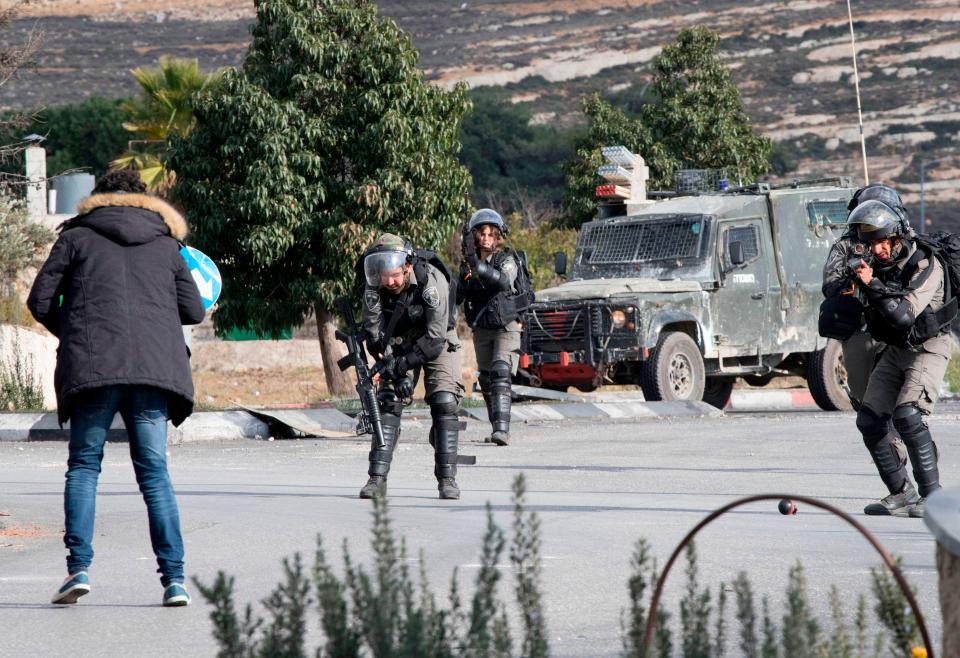 Israeli security forces shoot a Palestinian man after he allegedly stabbed a soldier