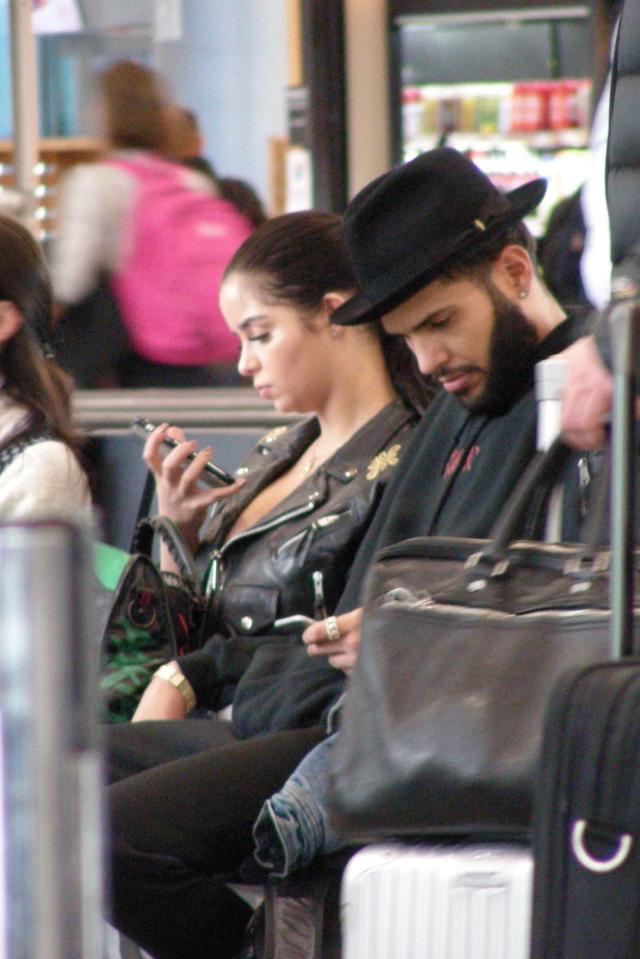  The pair checked their phones as they waited